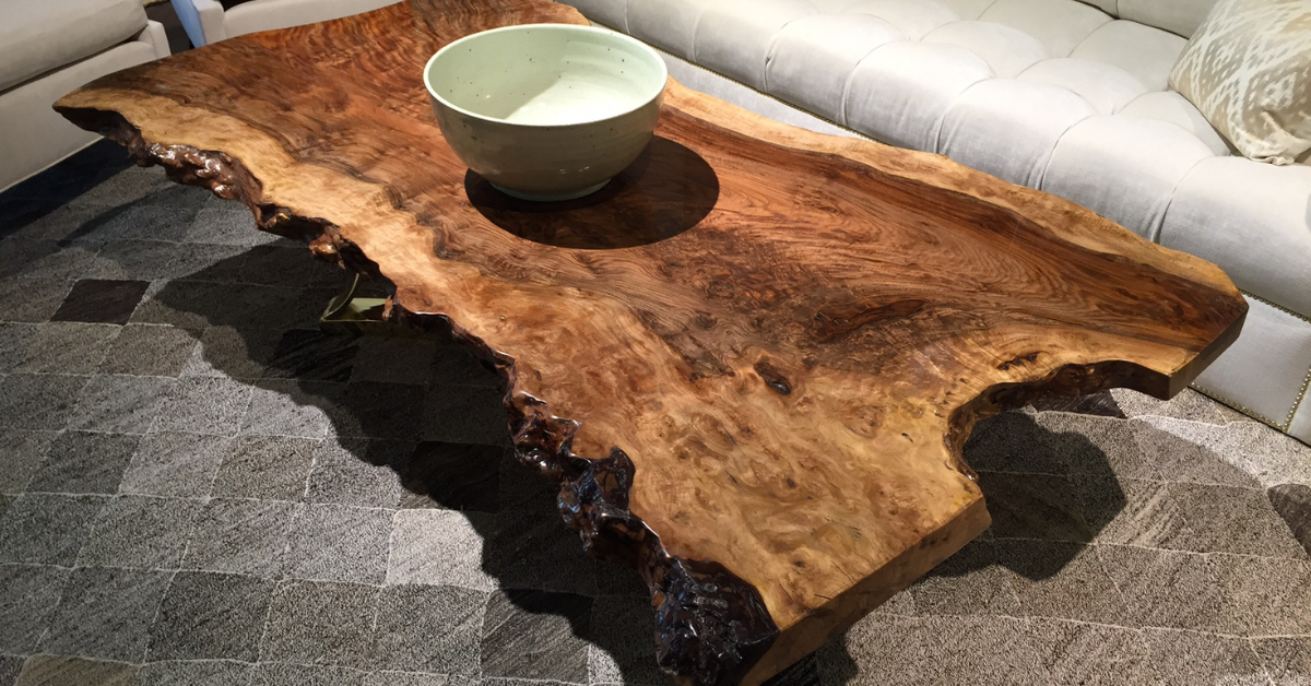 a live edge coffee table with a bowl on it