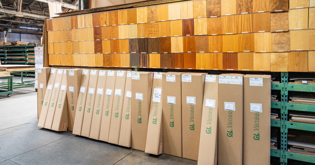 a bunch of wood veneer swatches with some GL Veneer branded boxes below