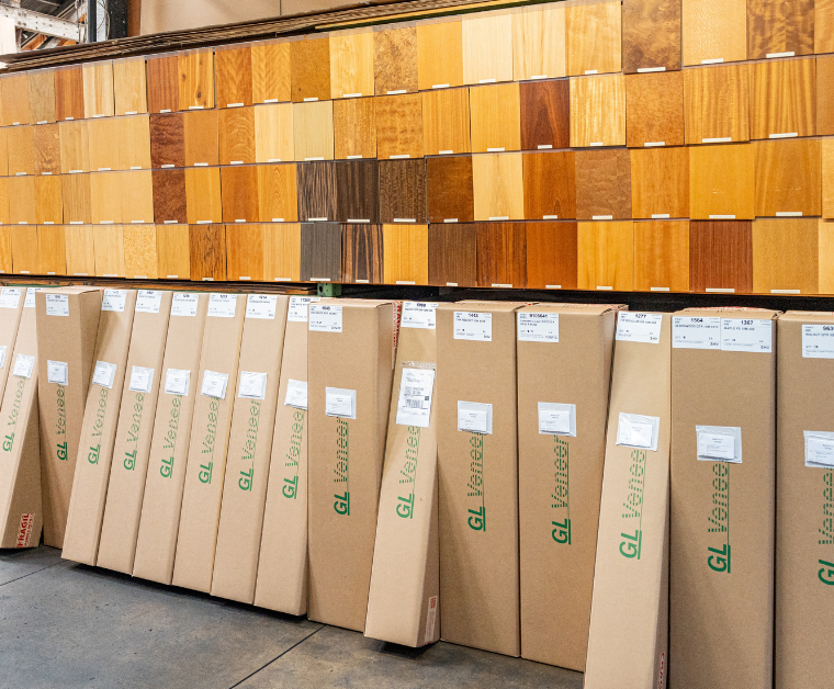 a bunch of wood veneer swatches with some GL Veneer branded boxes below